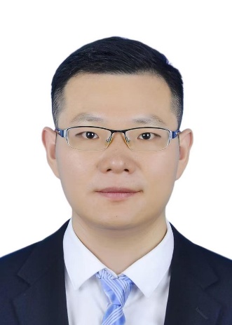 A person wearing glasses and a suitAI-generated content may be incorrect.